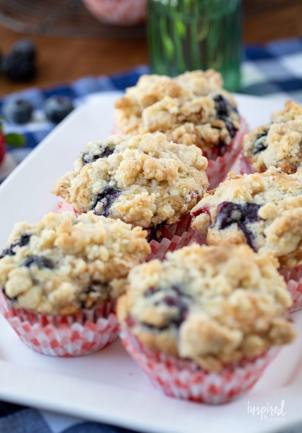 size Triple Berry Muffins on a white platter.