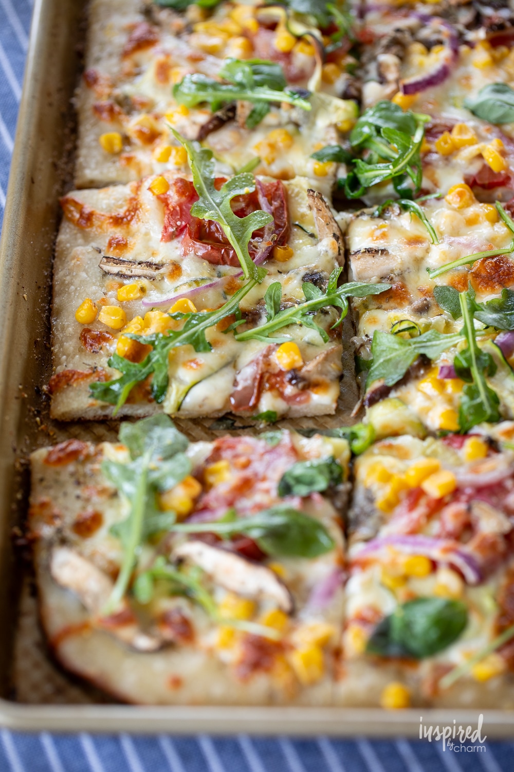 veggie pizza served baked in a sheet pan.