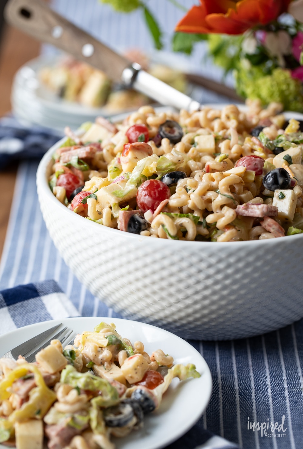 Italian Sub Pasta Salad in a large bowl and served on a plate. 