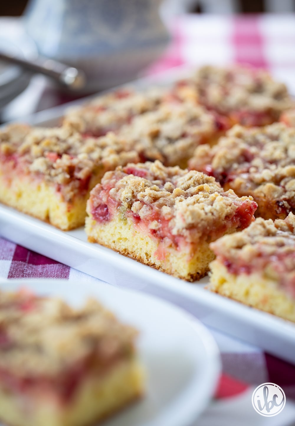 white platter with Strawberry Rhubarb Cake Bars