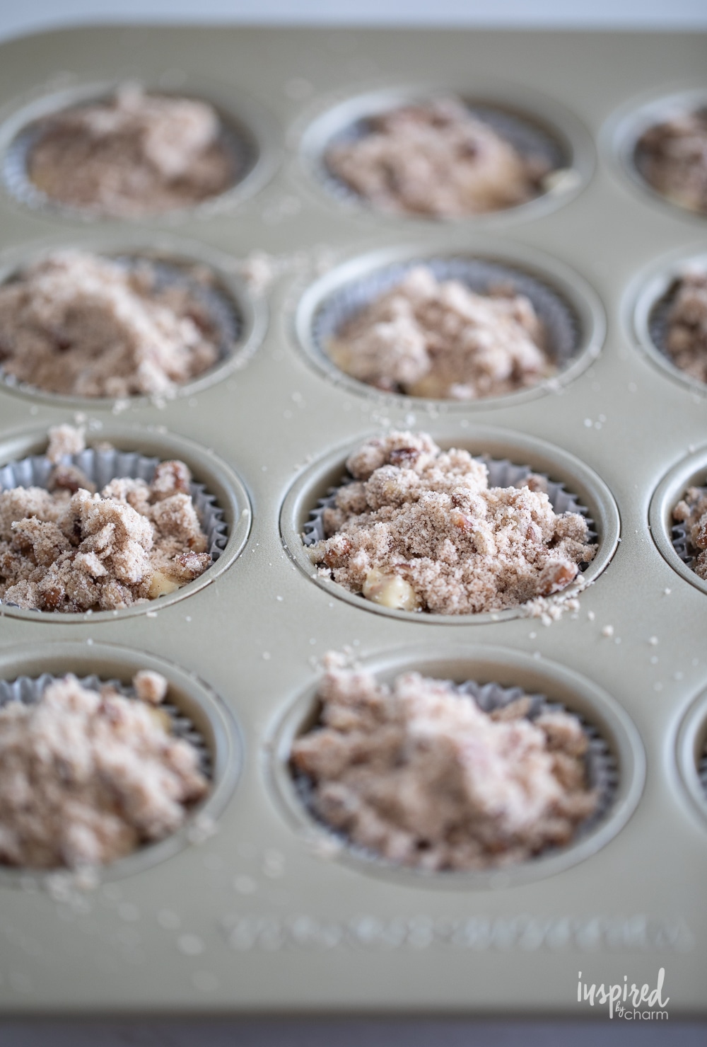 unbaked cinnamon maple morning muffins in a cupcake pan.