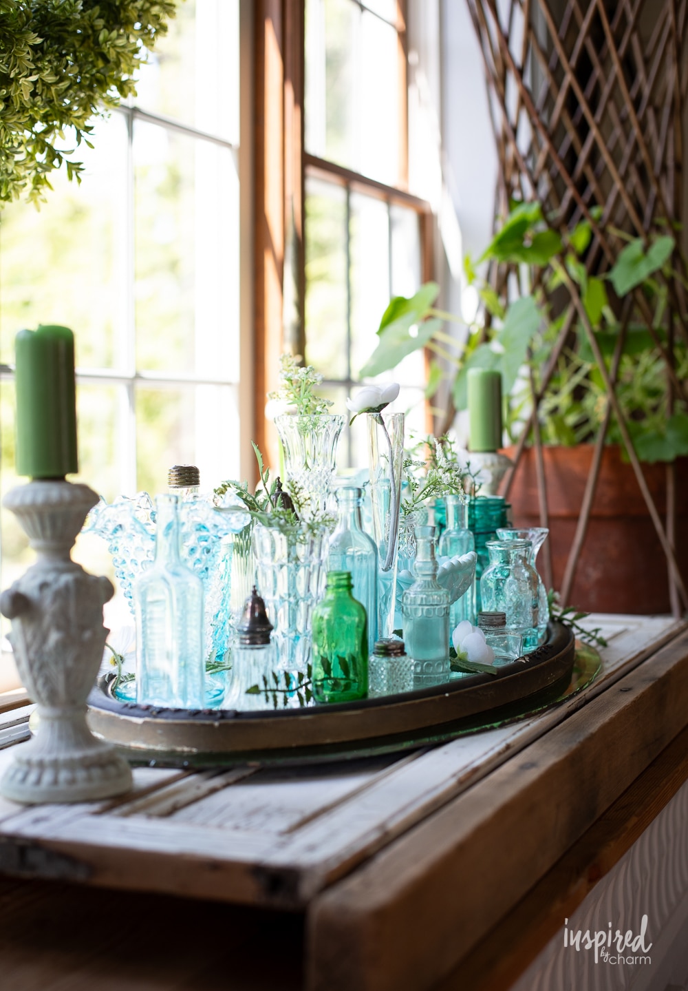 a display of vintage colorful glass on a tray.