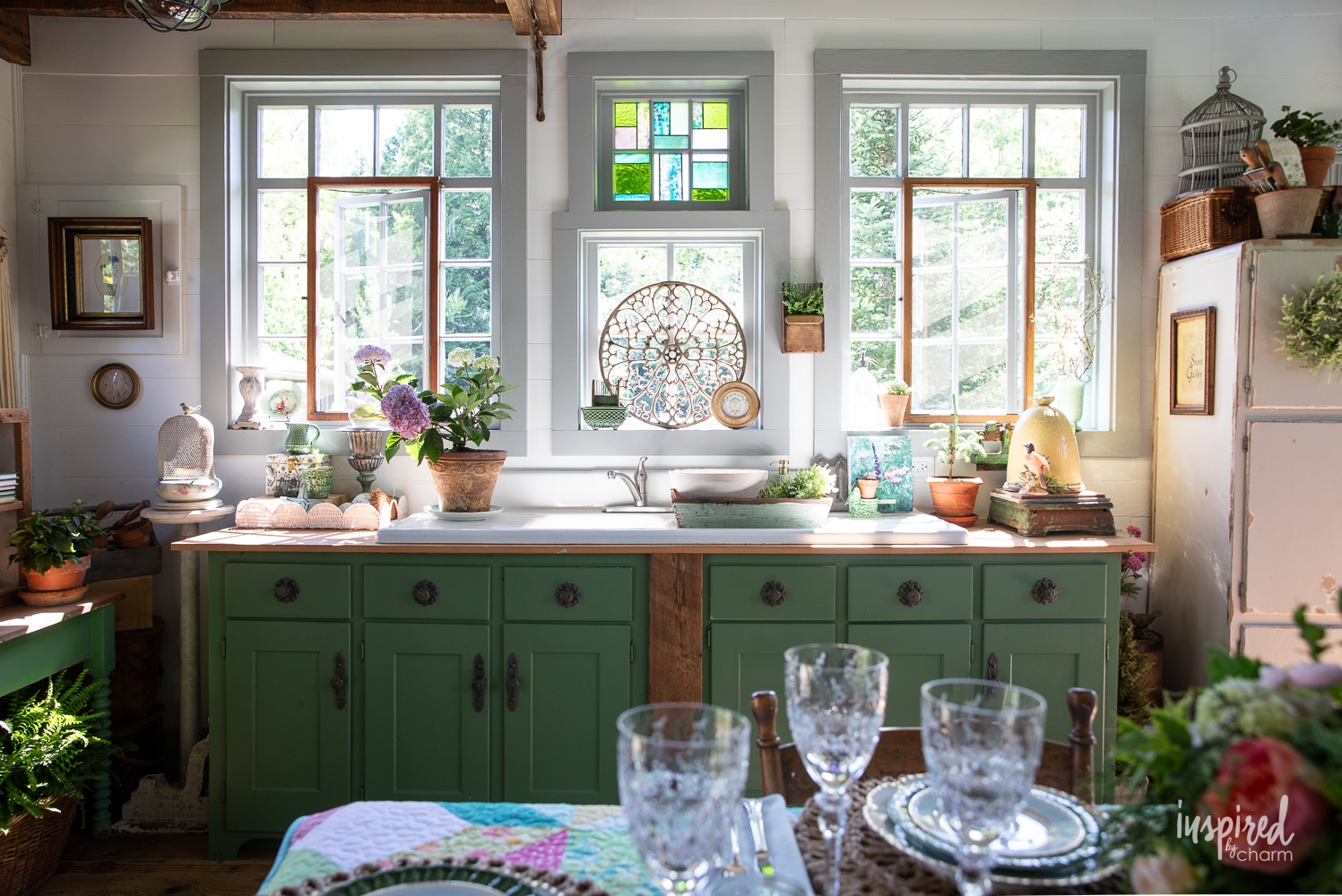 green cabinet and a sink with garden and vintage decor.