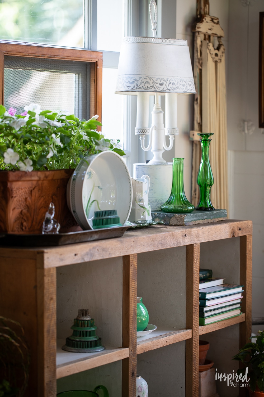 display of garden rings with little green bottles.