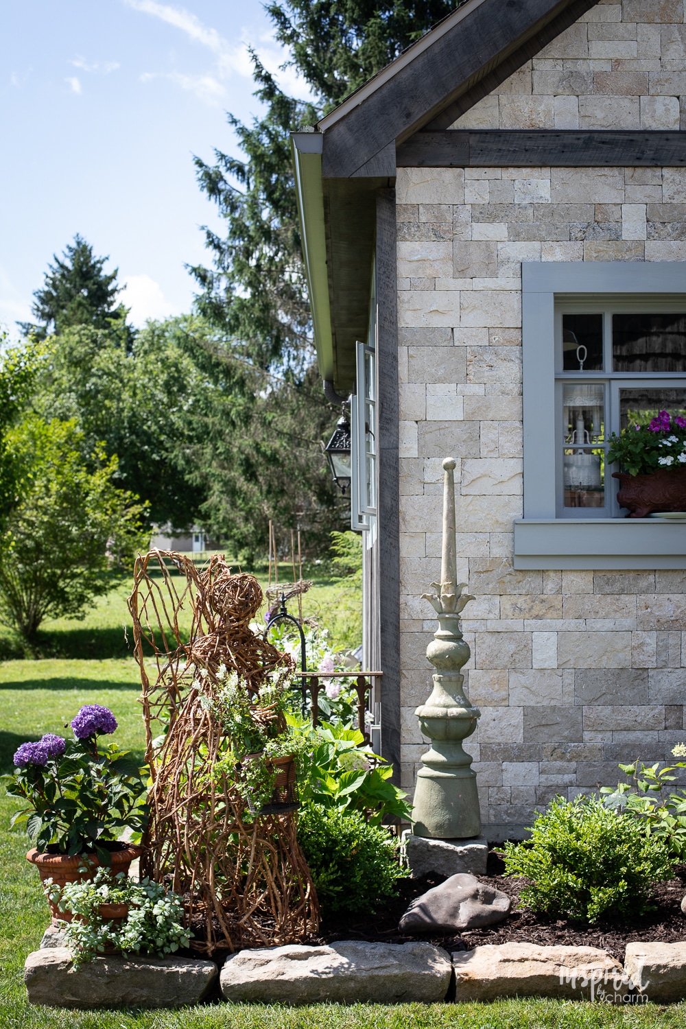 stone building with garden decor. 