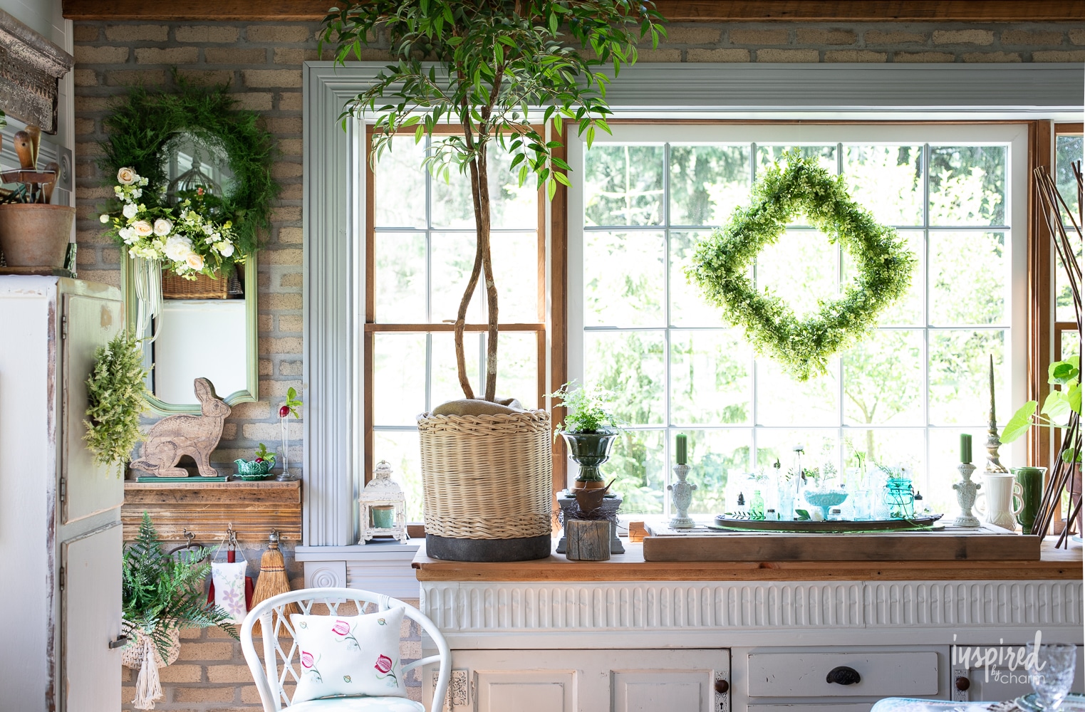 large window with garden and vintage decor surrounding it. 