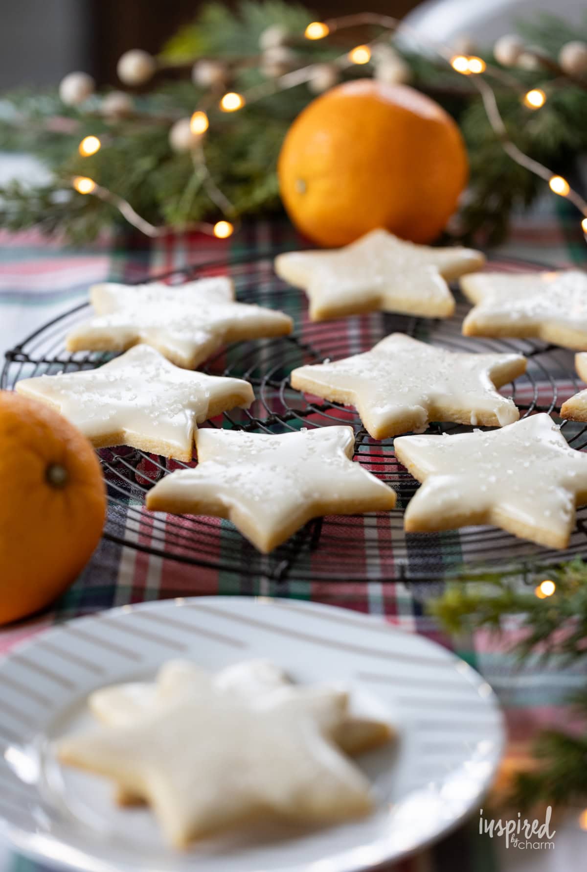 Orange Sugar Cookies in a star shape on a cooling rack.