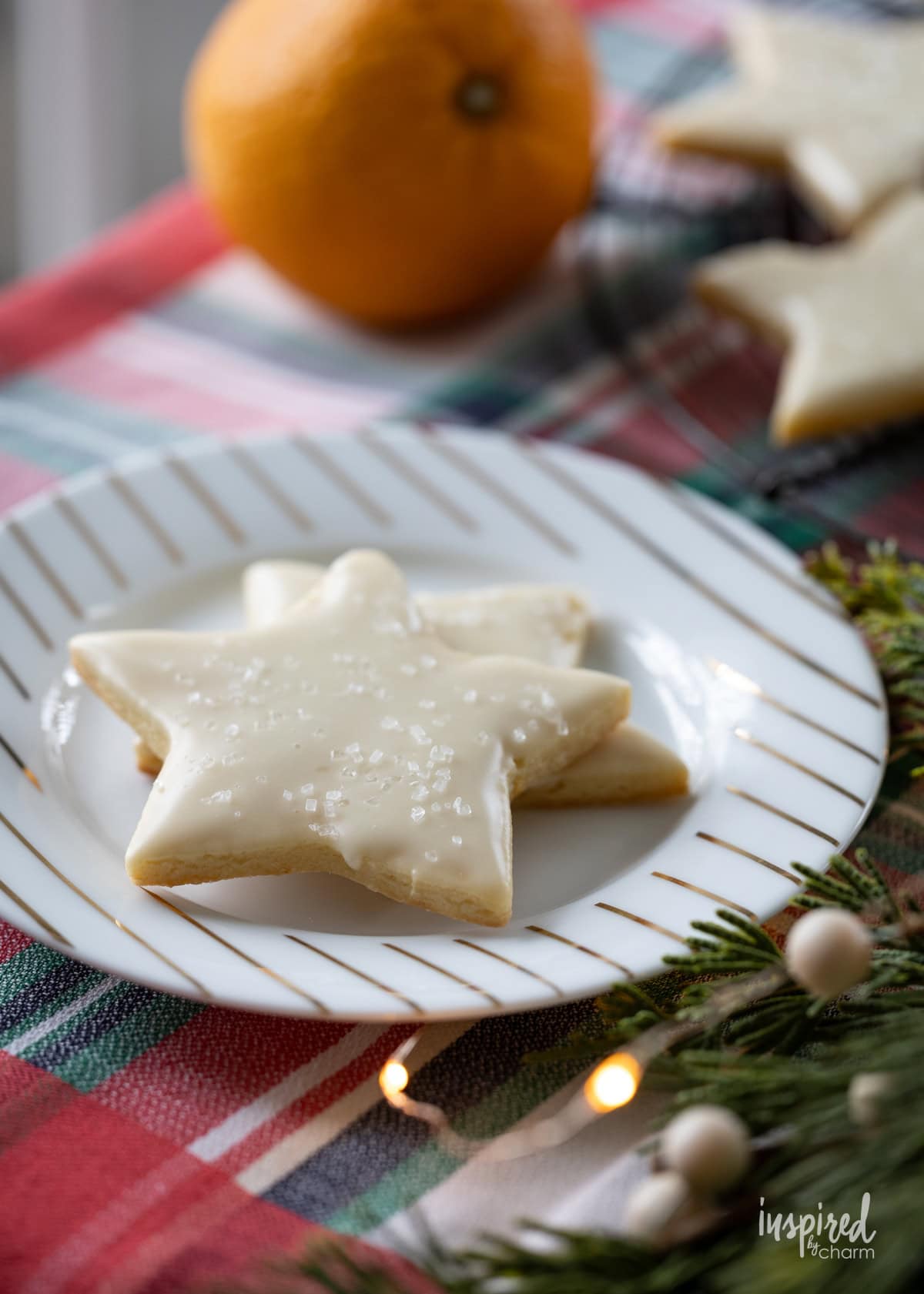 little plate with star shaped cookies on a table.