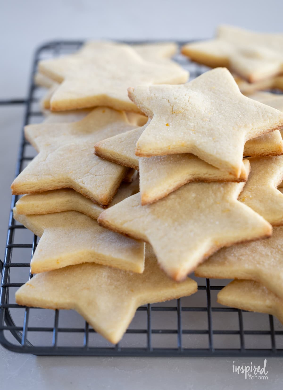 star shaped cookies on a cooling rack.