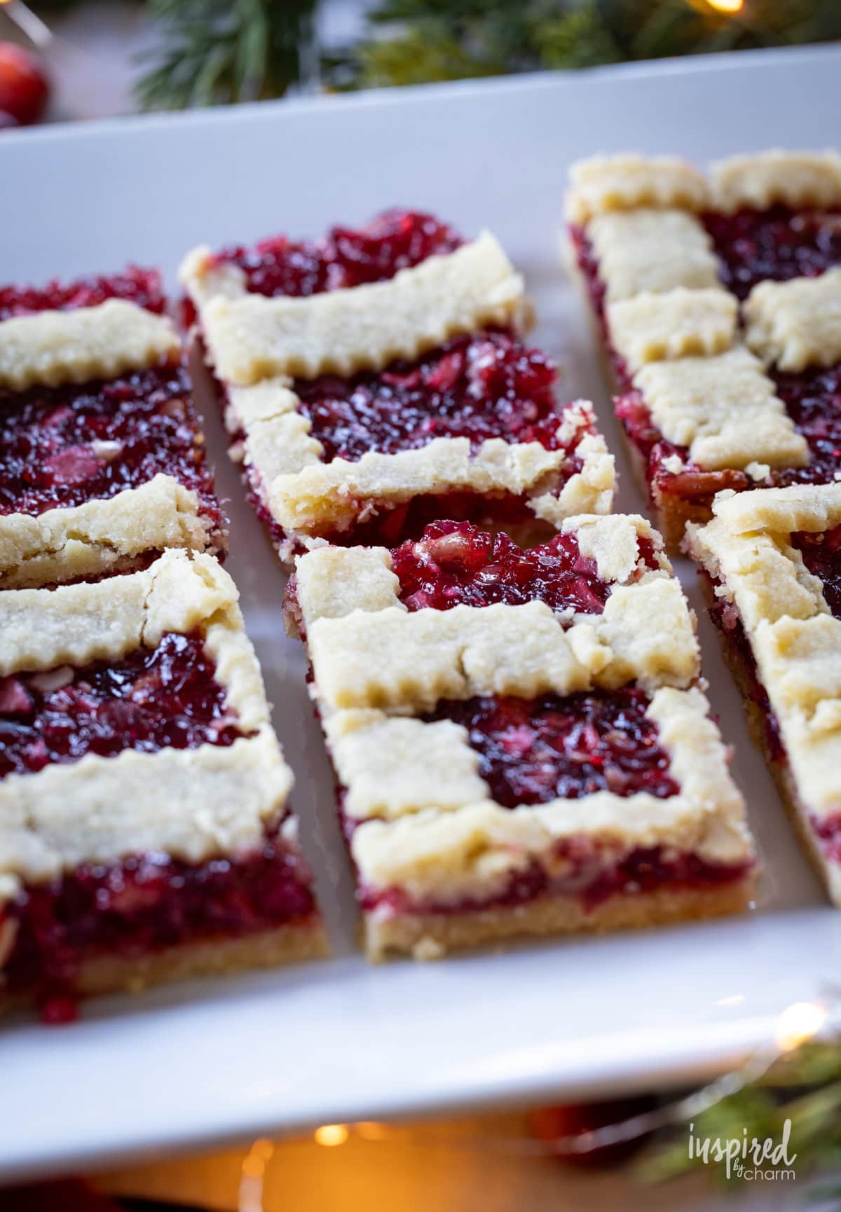 white platter with apple cranberry bars. 