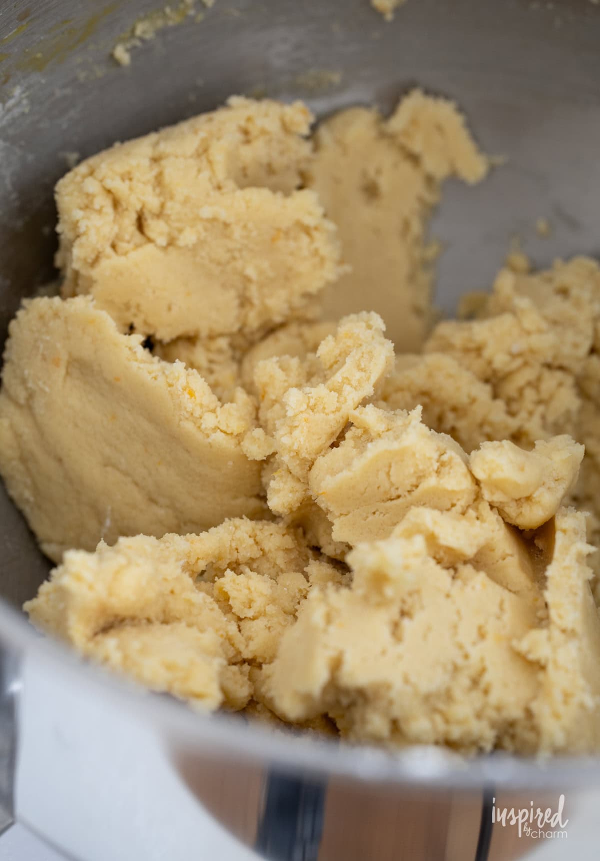 orange sugar cookie dough in a bowl.