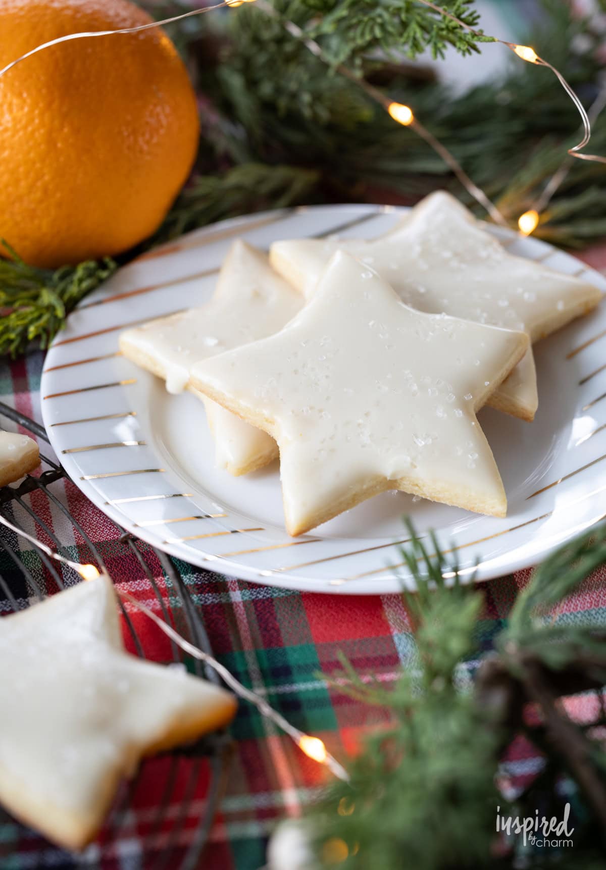 plate of orange sugar cookie with glaze.