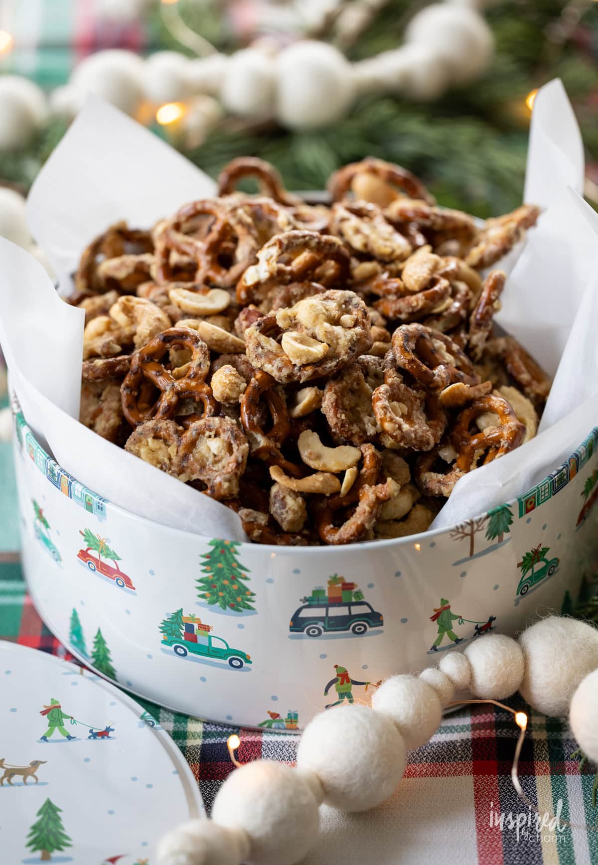 Christmas tin filled with Sweet & Salty Cashew Toffee Pretzels.