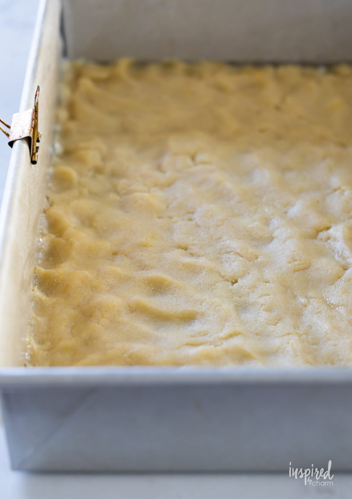 crust for apple cranberry bars in a baking pan.