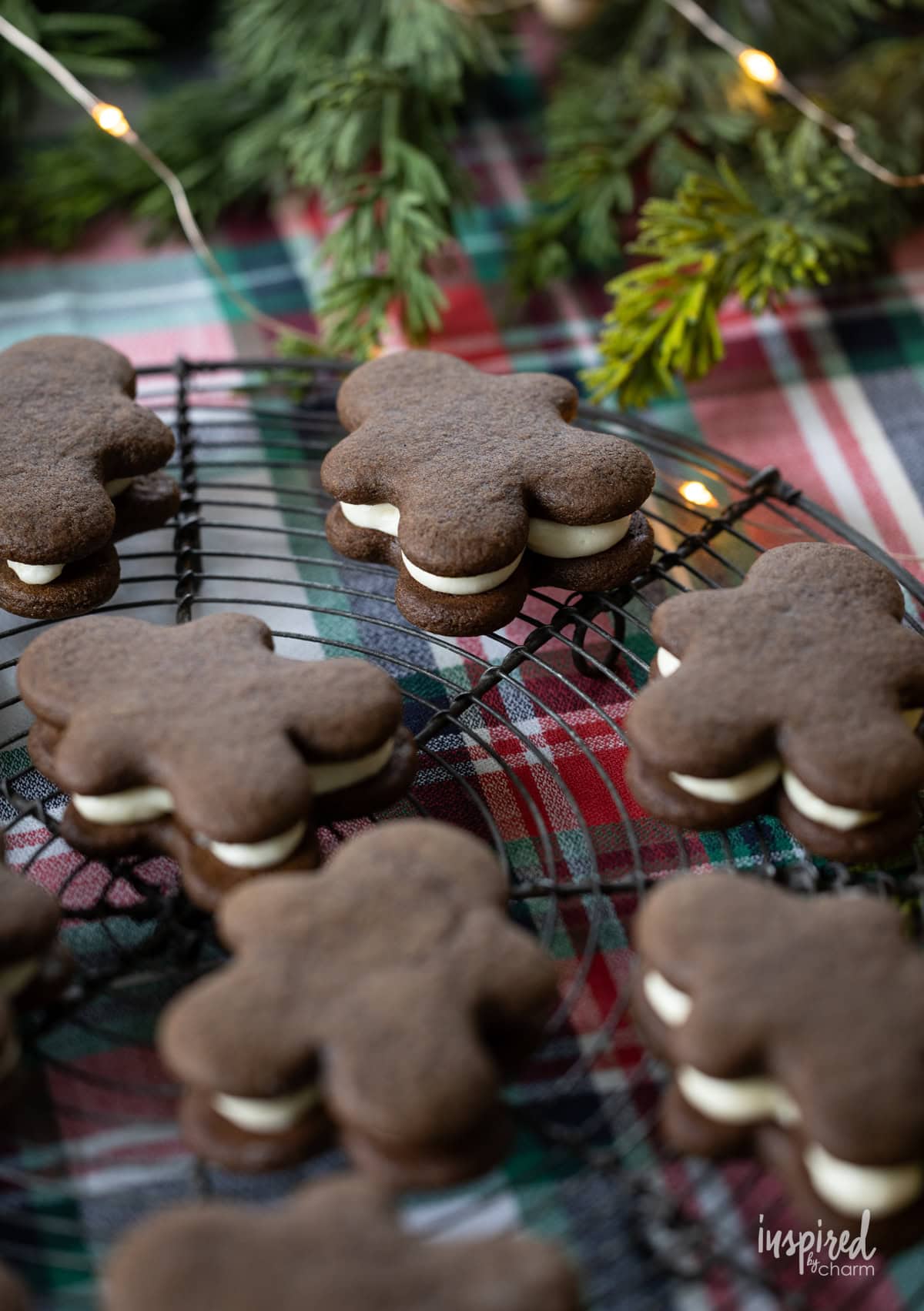 gingerbread sandwich cookies on a cooling rack.
