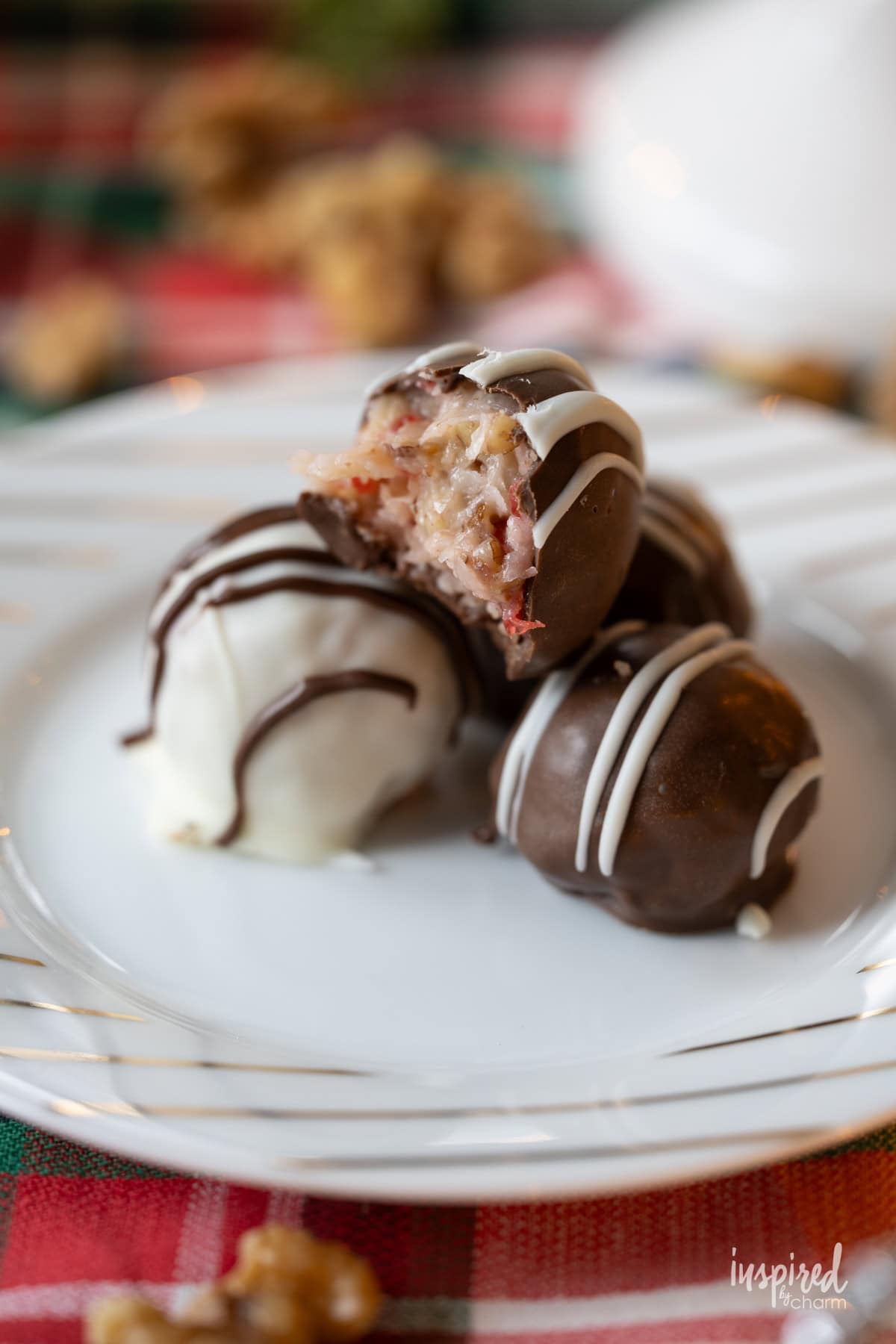 four Cherry Coconut Pecan Candies on a small plate.