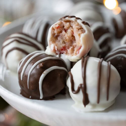 chocolate candy balls with one bite taken out.