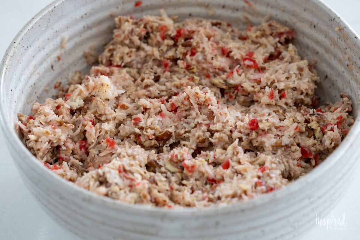mixed up ingredients for Cherry Coconut Pecan Candies in a bowl.