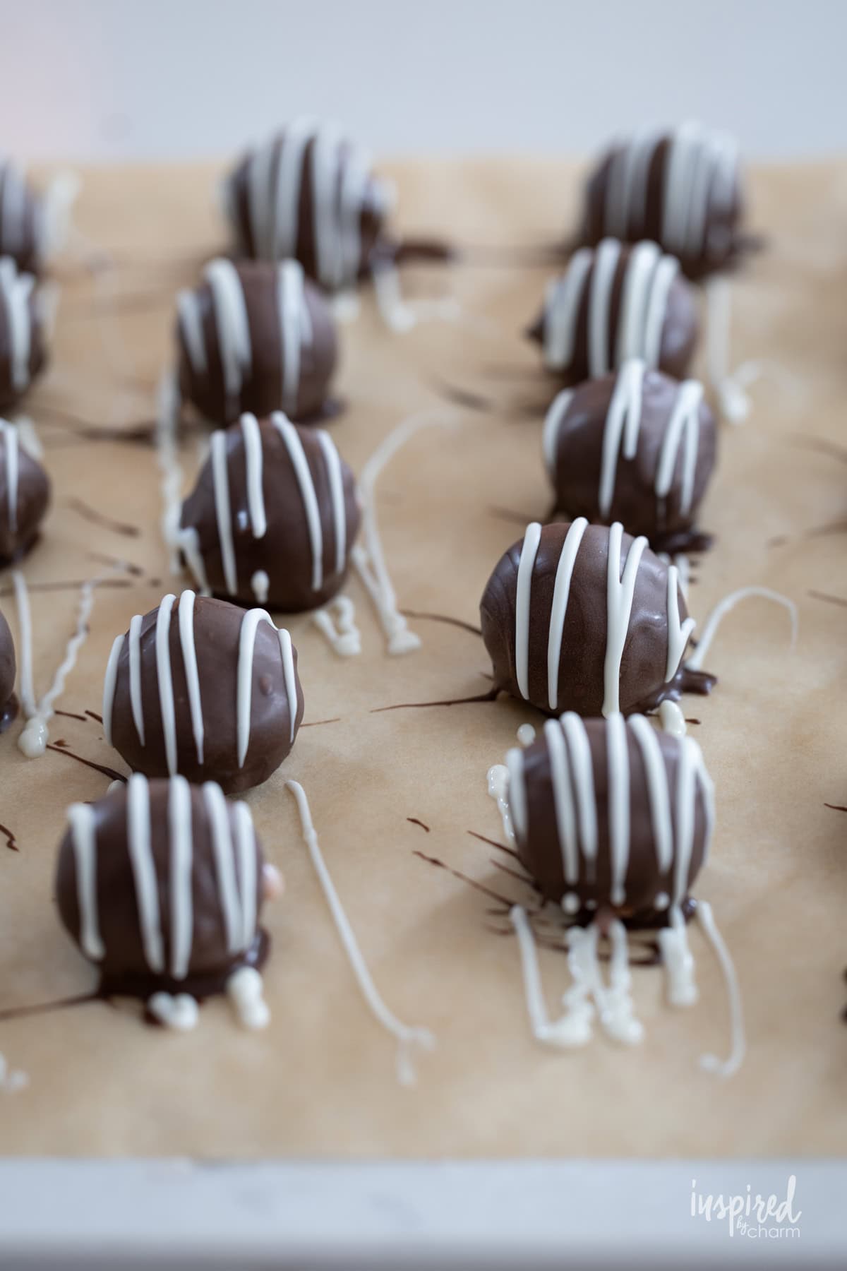 balls of chocolate drizzled with white chocolate. 