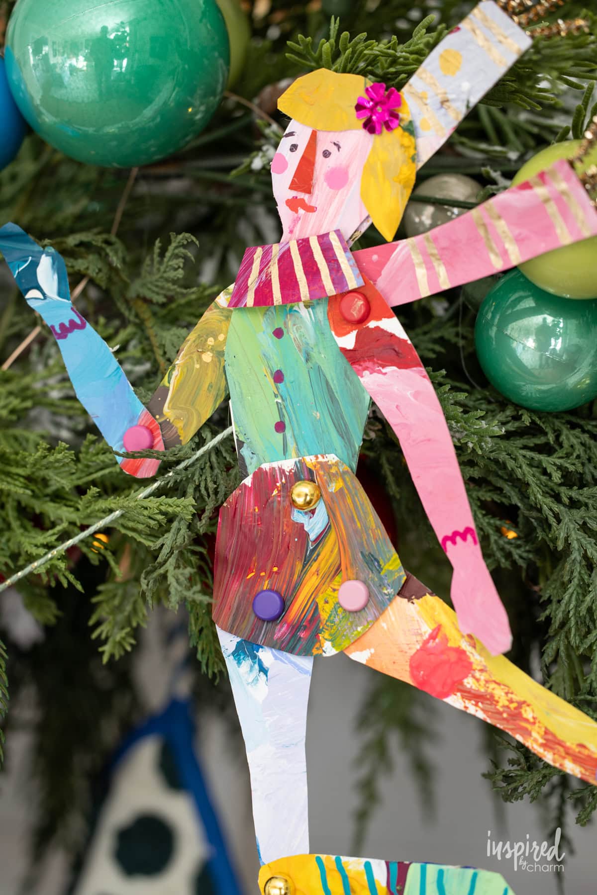 female figure made form colorful papers and accessories. 