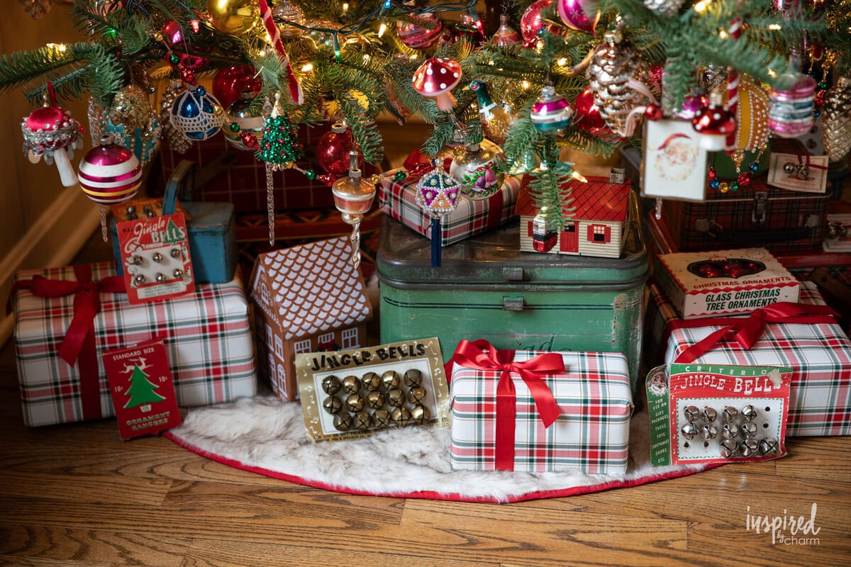 vintage decor and presents underneath a christmas tree.
