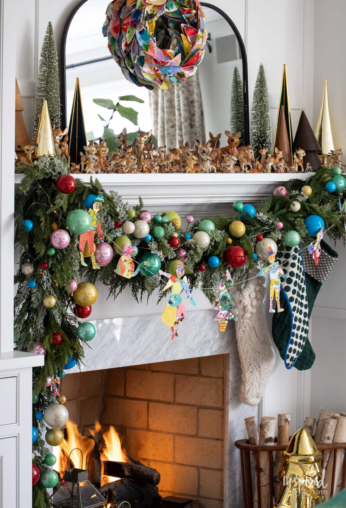 mantel decorated for christmas with colorful decor.