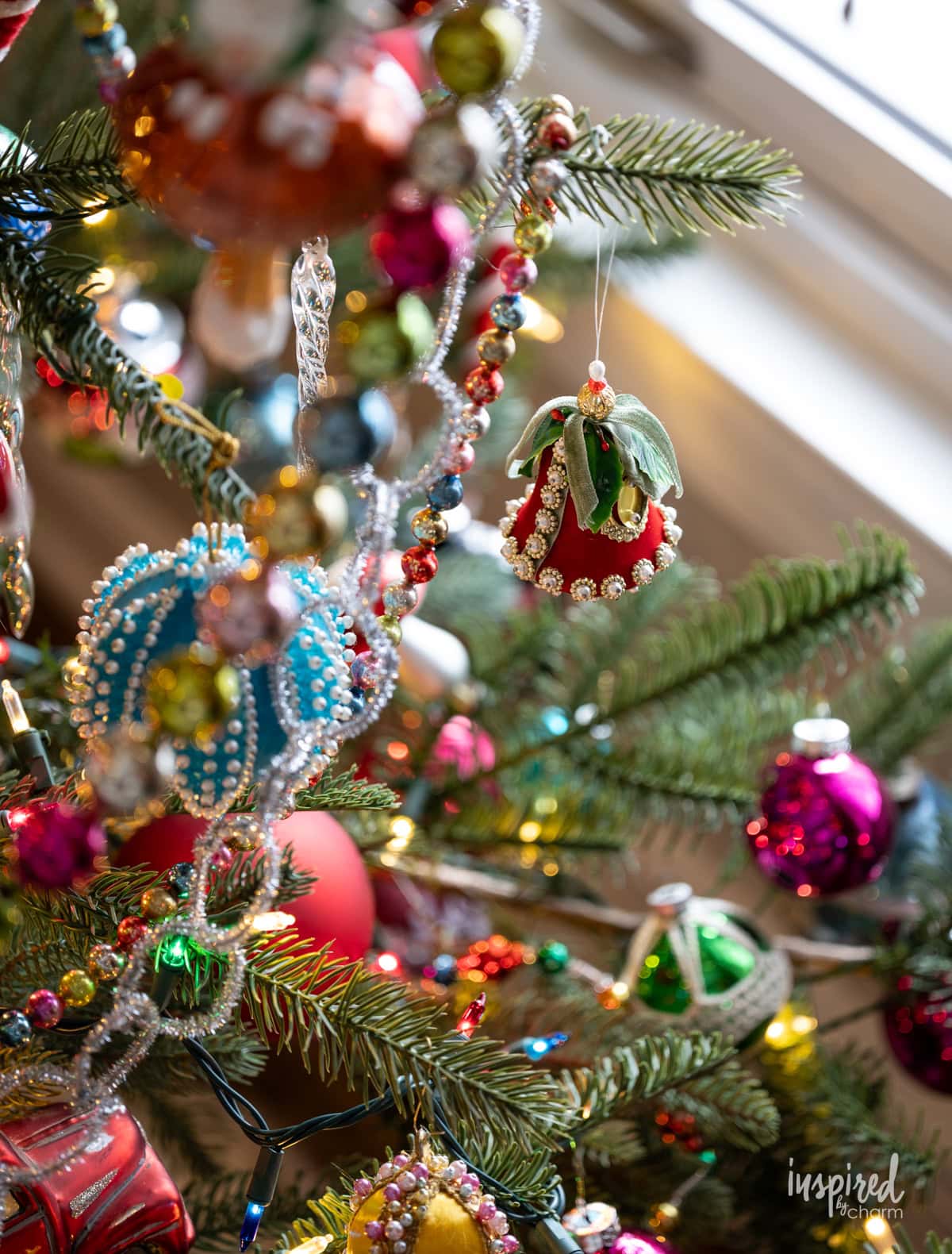 vintage ornament hung on a christmas tree.