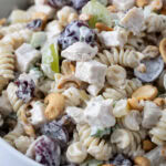 Chicken and Cashew Pasta Salad in a white bowl.