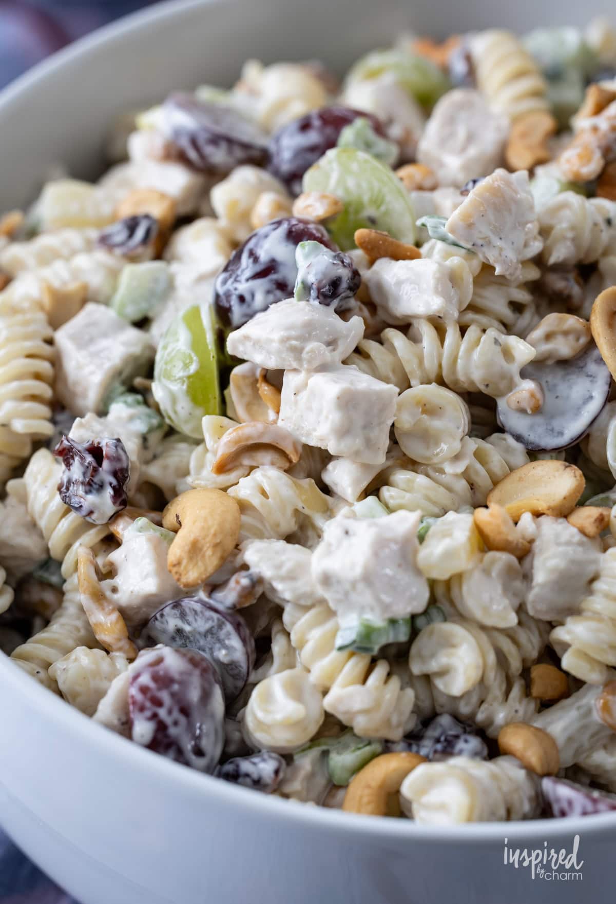 Chicken and Cashew Pasta Salad in a white bowl.