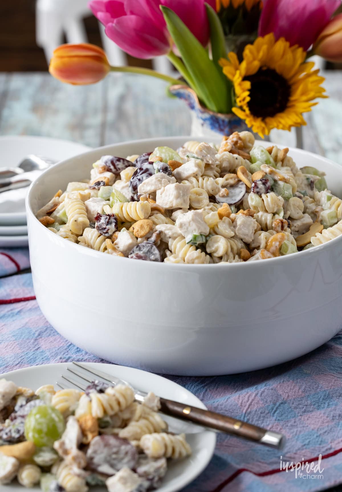Chicken and Cashew Pasta Salad served in a bowl and on a small plate.
