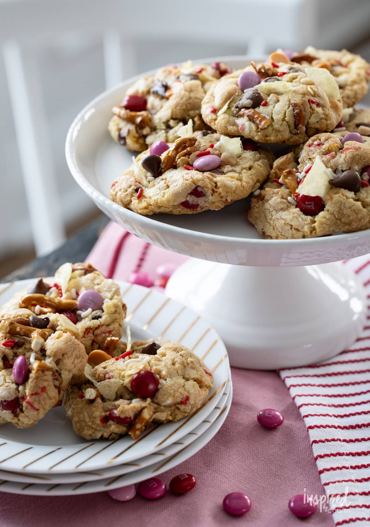 Kitchen Sink Cookies for Valentine’s Day served on a cake stand and small plates.