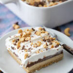 slice of Peanut Butter Chocolate Pudding Dessert on a small plate.