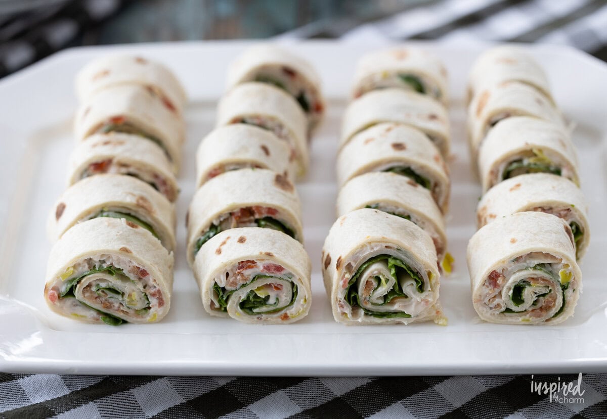 platter filled with Turkey Club Sandwich Roll-Ups.
