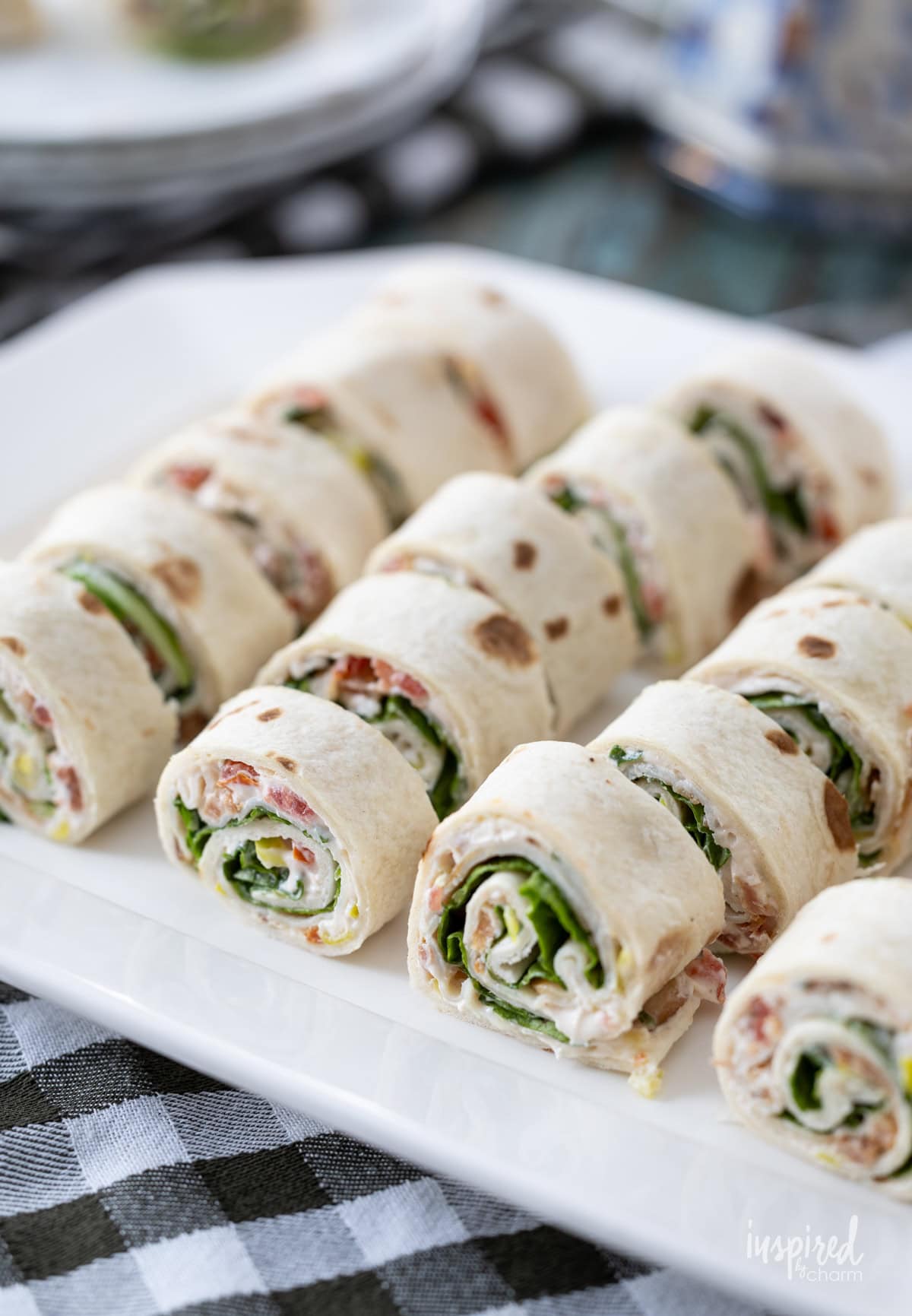 platter filled with Turkey Club Sandwich Roll-Ups.