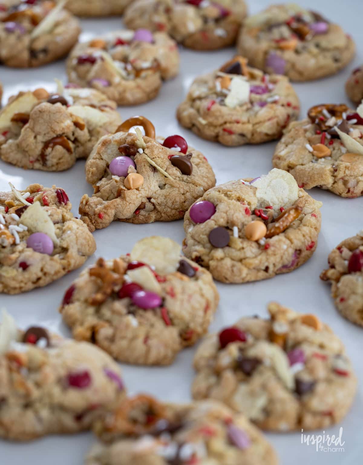 baked Kitchen Sink Cookies for Valentine’s Day on parchment paper.