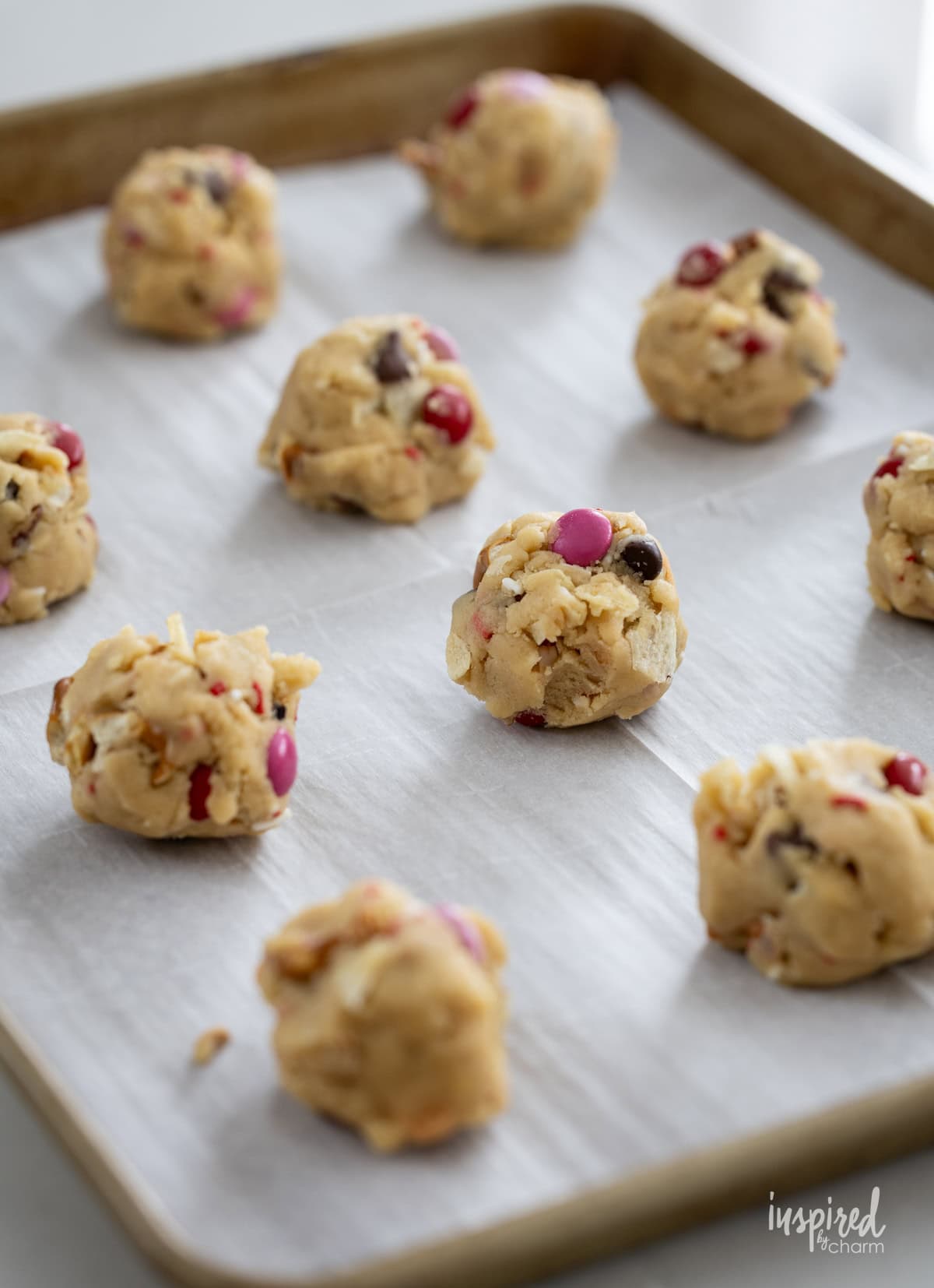 Kitchen Sink Cookies dough balls on baking sheet.
