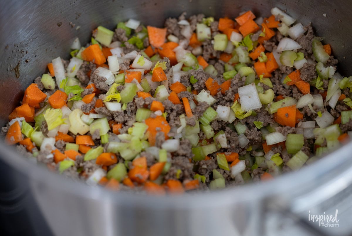 ground beef with celery, carrots, and onions.