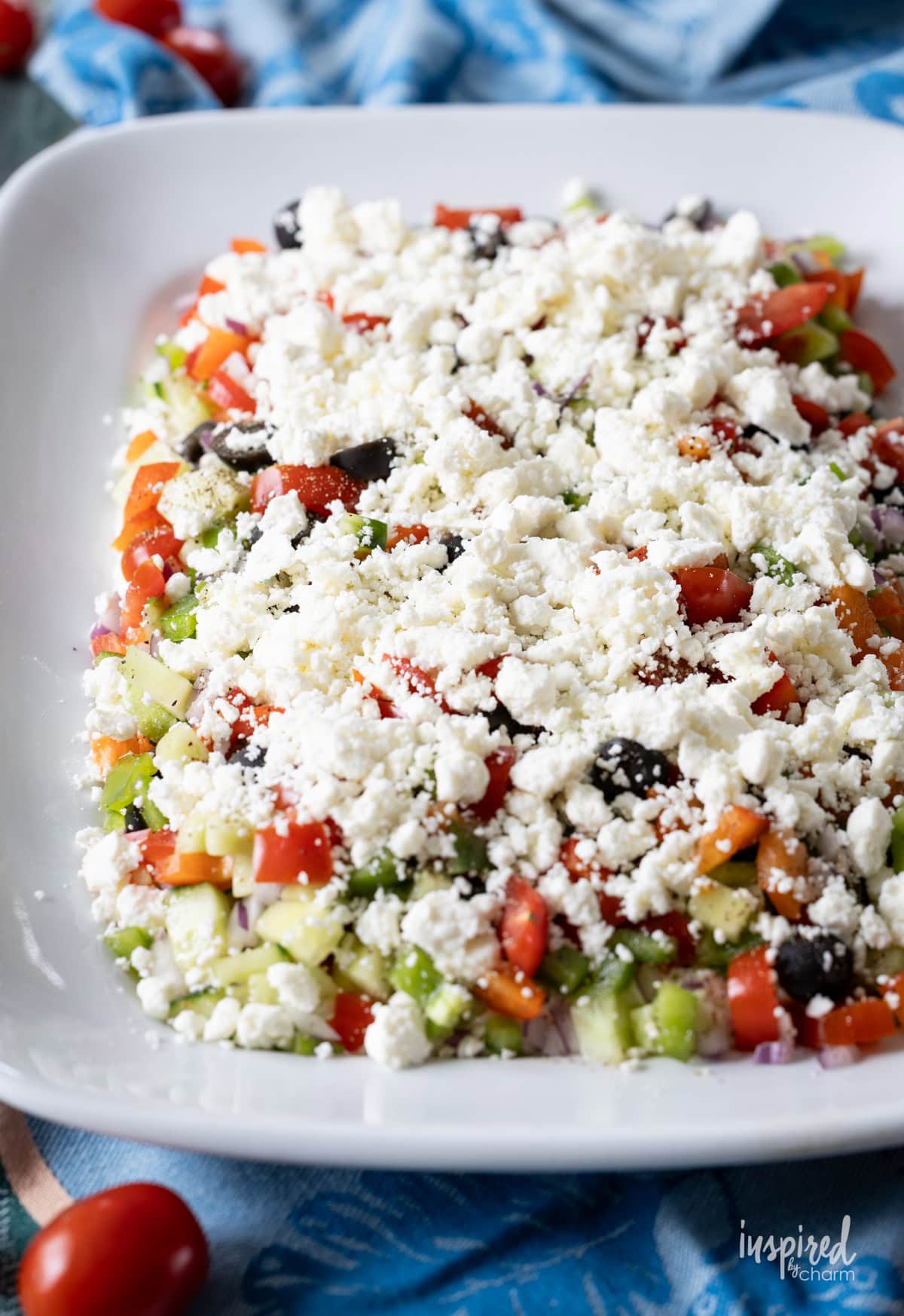large platter filled with greek feta layer dip.