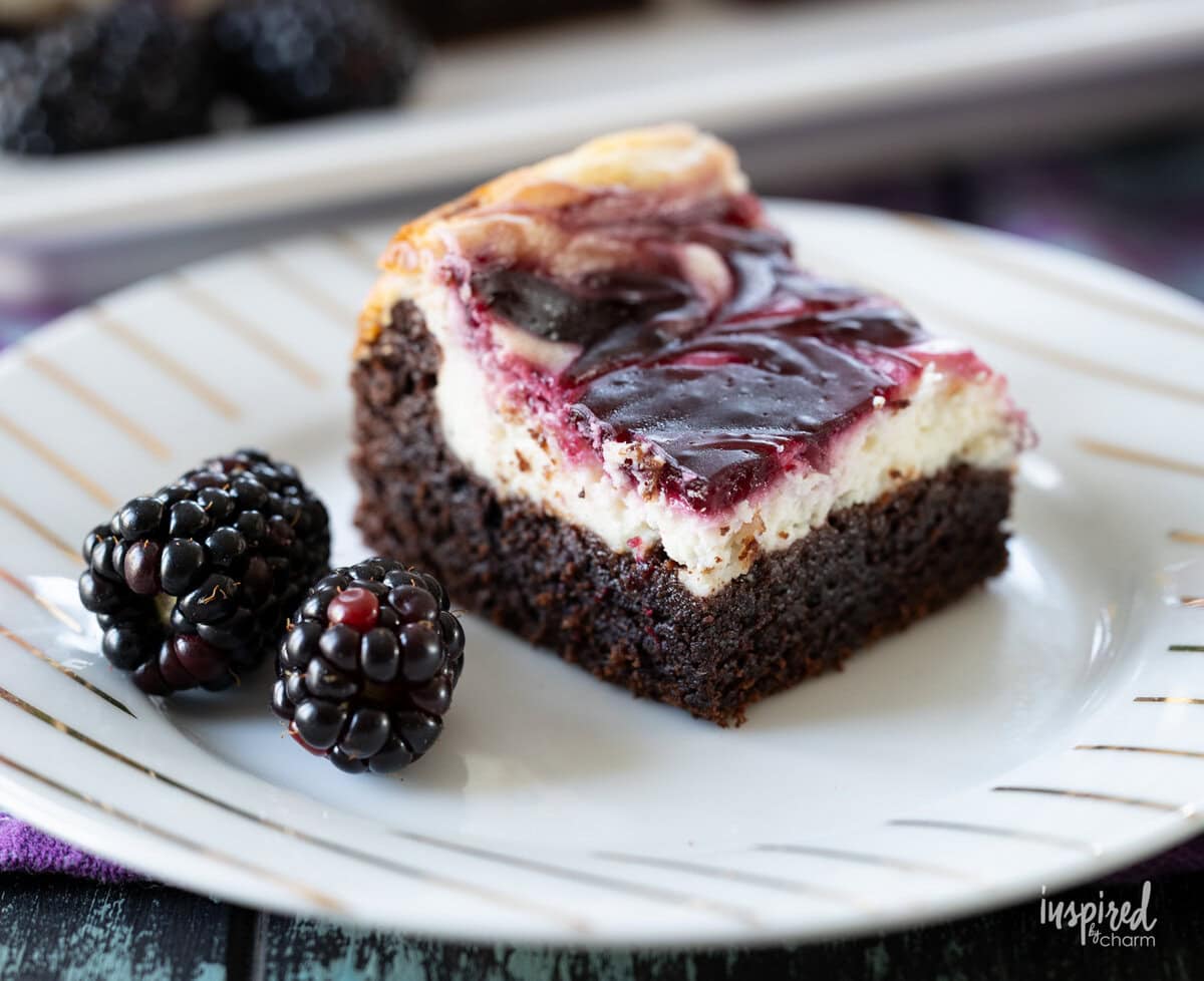 single Blackberry Cheesecake Brownie on a plate.