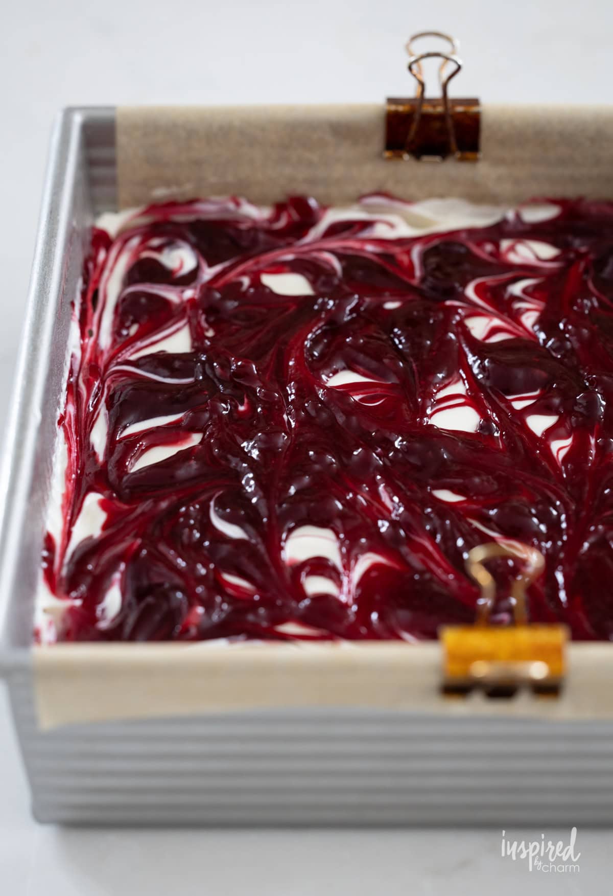 unbaked blackberry cheesecake brownies in a pan. 