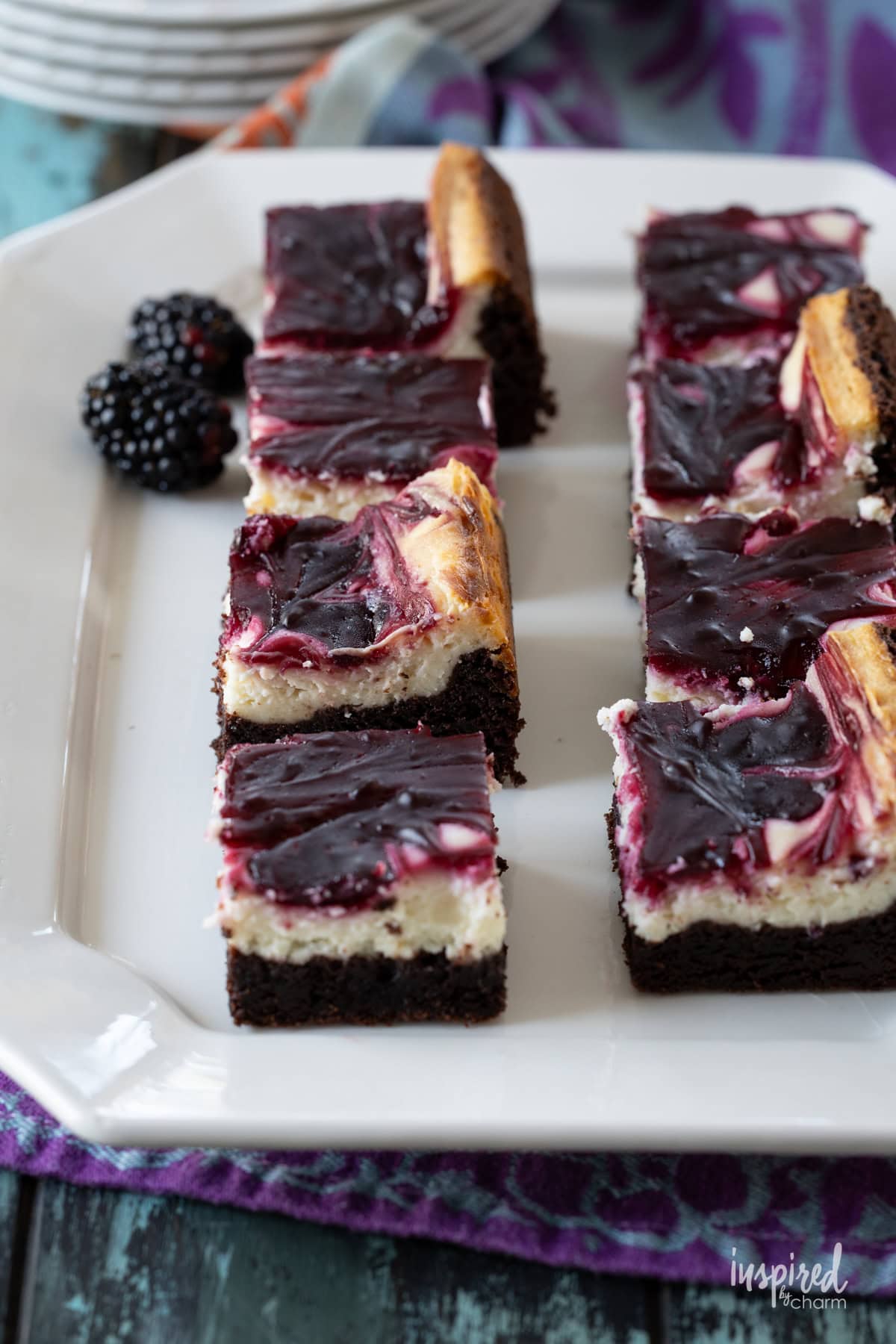 platter filled with blackberry cheesecake brownies. 