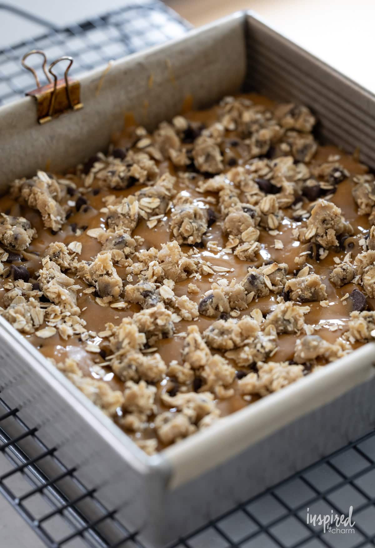 unbaked Chocolate Chip Caramel Cookie Bars in a pan. 