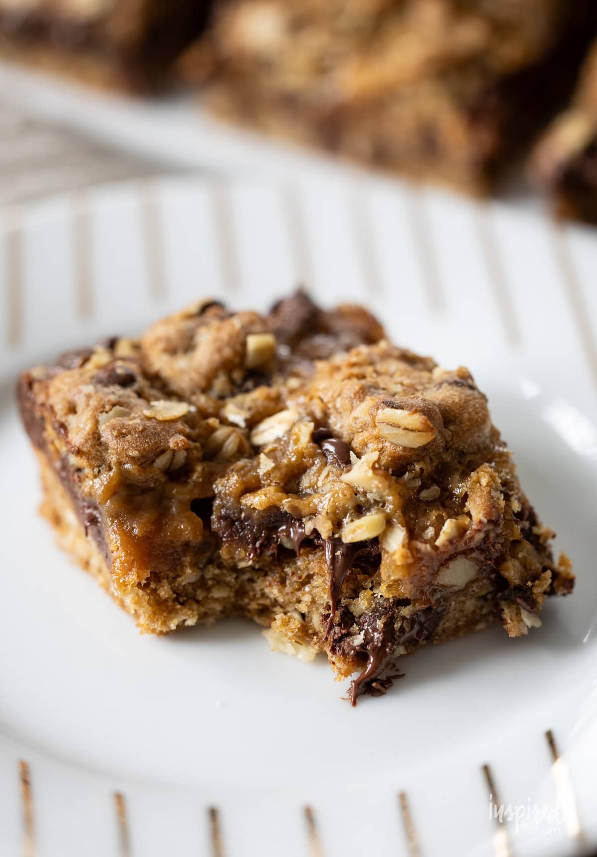 Chocolate Chip Caramel Cookie Bar with a bite taken out. 