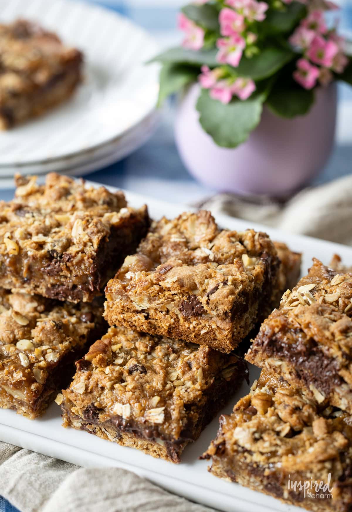 stacks of Chocolate Chip Caramel Cookie Bars on a platter.
