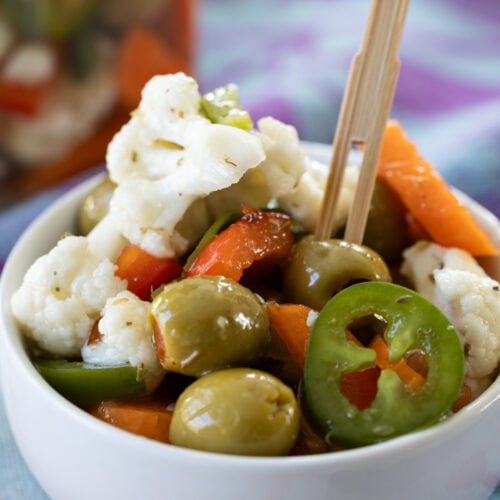 Giardiniera in a small dish with a toothpick.
