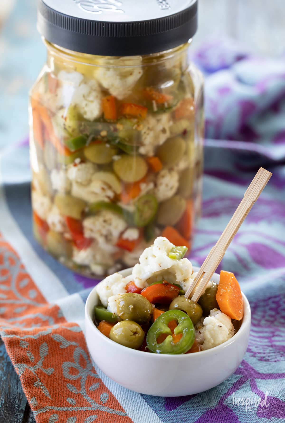 jar of  Giardiniera with some served in a small white dish.