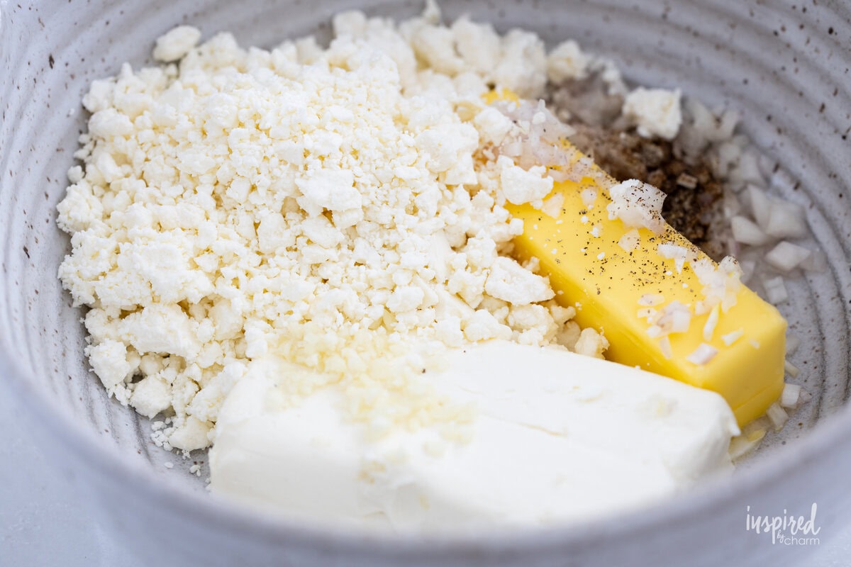 ingredients for Pesto and Feta Layer Dip in a bowl. 