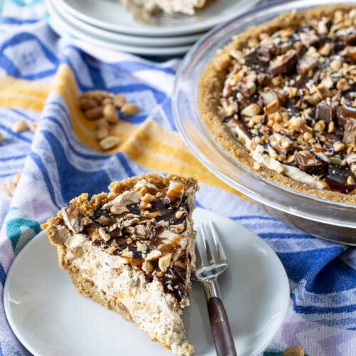 Peanut Butter Snickers Pie served on a small plate.