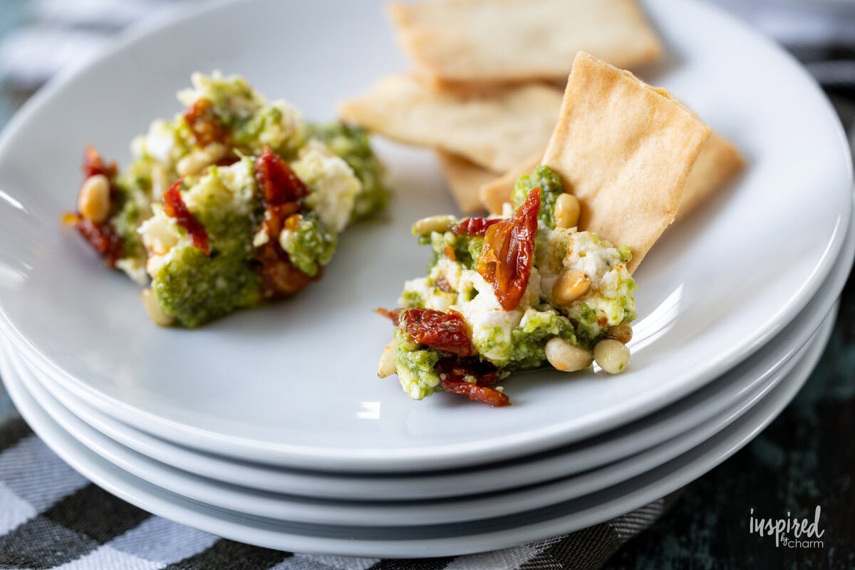 small plate with Pesto and Feta Layer Dip and chips.