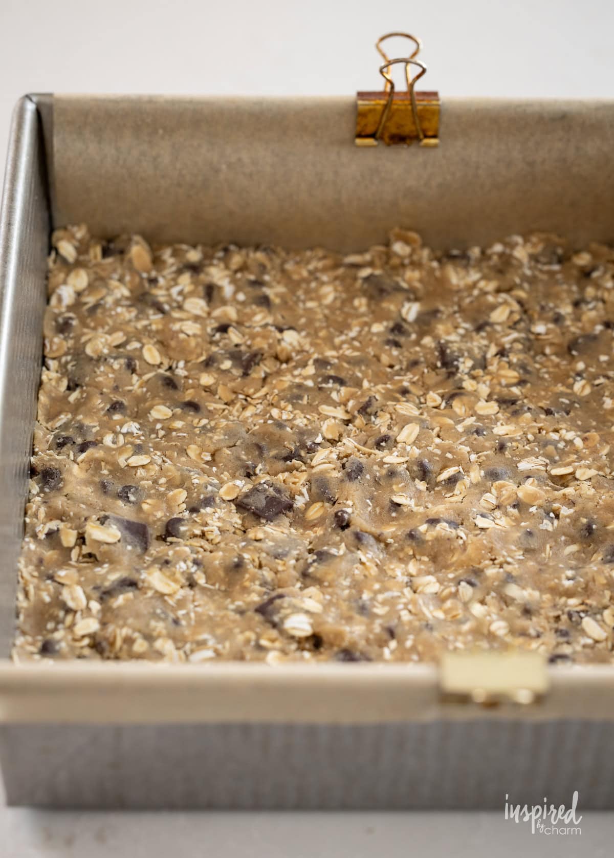 crust for Chocolate Chip Caramel Cookie Bars in a pan.